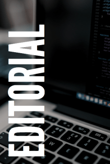 "Editorial" with a computer in the background